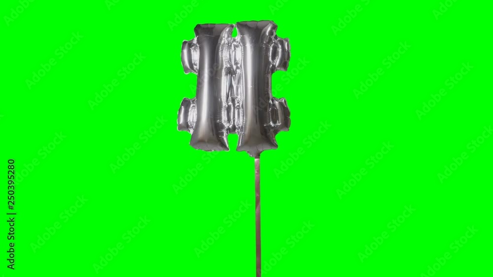 Sign symbol number hash pound and from alphabet helium silver balloon floating on green screen Sign symbol number hash pound and from alphabet helium silver balloon floating on green screen