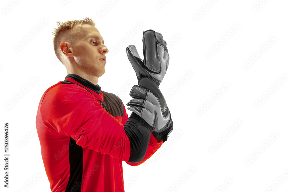 One male soccer player goalkeeper standing at studio. Silhouette isolated on white studio background One male soccer player goalkeeper standing at studio. Silhouette isolated on white studio background