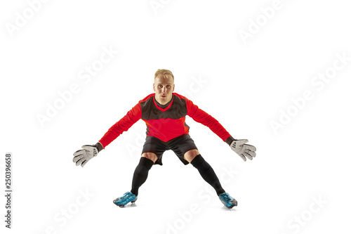 Goalkeeper ready to save on white studio background. Soccer football concept