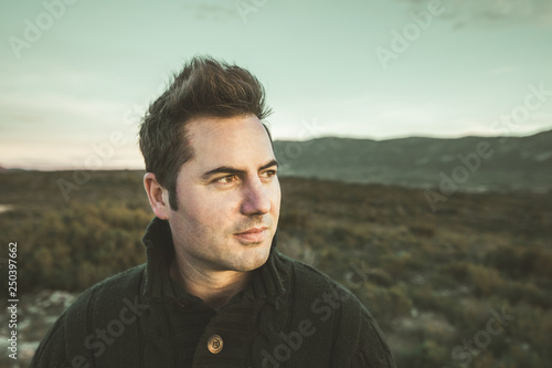 Portrait of a modern profile guy smiling outdoors. Photo style social networks and vintage