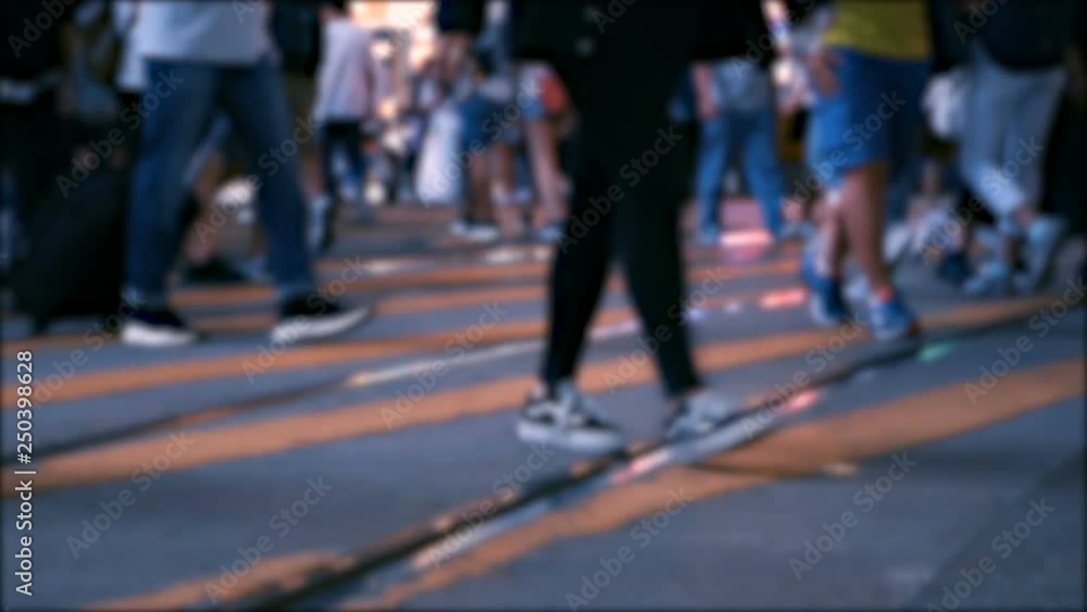 Crowded crosswalk. People crossing street in busiest area of Hong Kong. City life. Night wide shot in rush hour. Slow motion shot Crowded crosswalk. People crossing street in busiest area of Hong Kong. City life. Night wide shot in rush hour. Slow motion shot