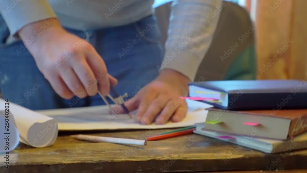 paper work.working with documents at the table.close-up.men's hands, paper documents and various office supplies on the table.business concept.screen saver on business topics paper work.working with documents at the table.close-up.men's hands, paper documents and various office supplies on the table.business concept.screen saver on business topics