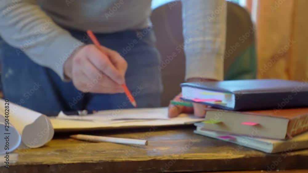 man works at a desk with documents.blurred video.screen saver on business topics. man works at a desk with documents.blurred video.screen saver on business topics.