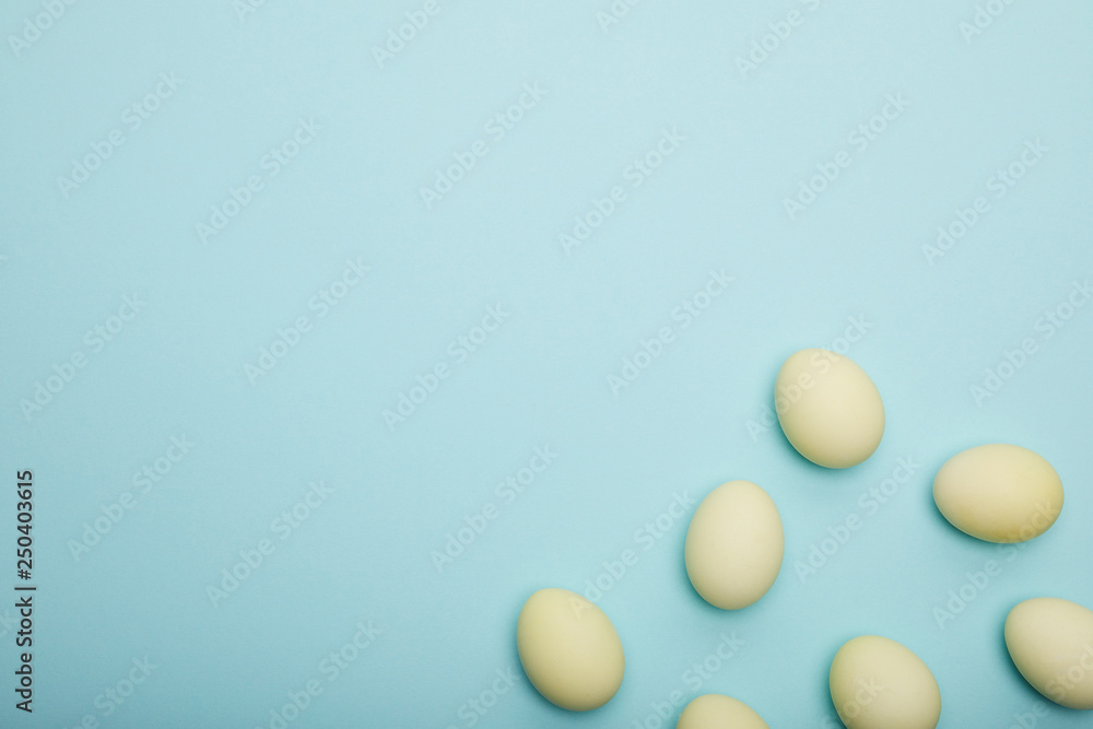 Top view of painted easter eggs on blue background