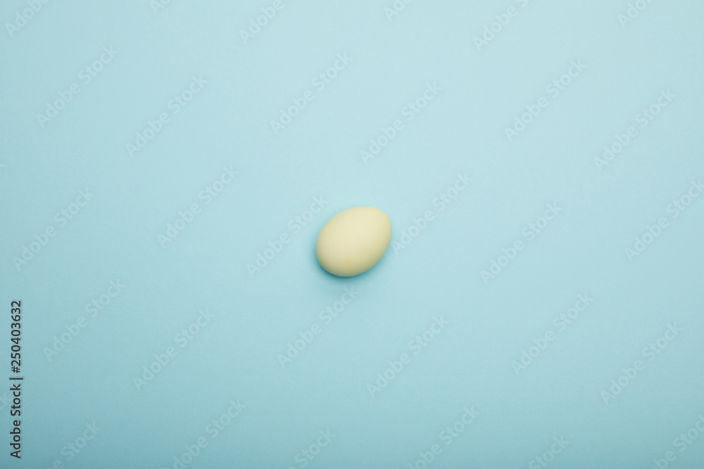 Top view of easter egg on blue background Top view of easter egg on blue background