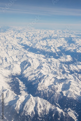 Aerial view of snow covered mountains - snowy mountain peaks - high mountains - Alps