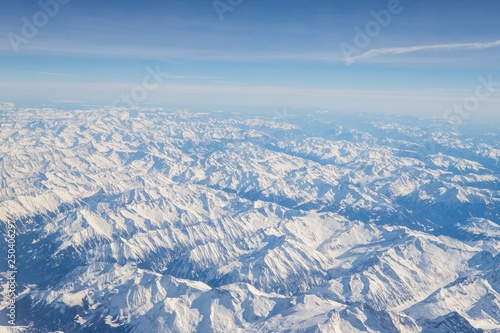 Aerial view of snow covered mountains - snowy mountain peaks - high mountains - Alps