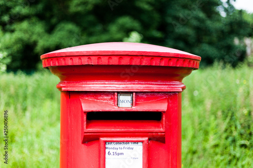 British red mailbox for gathering mail. Traditional mail gathering mailbox © Artur