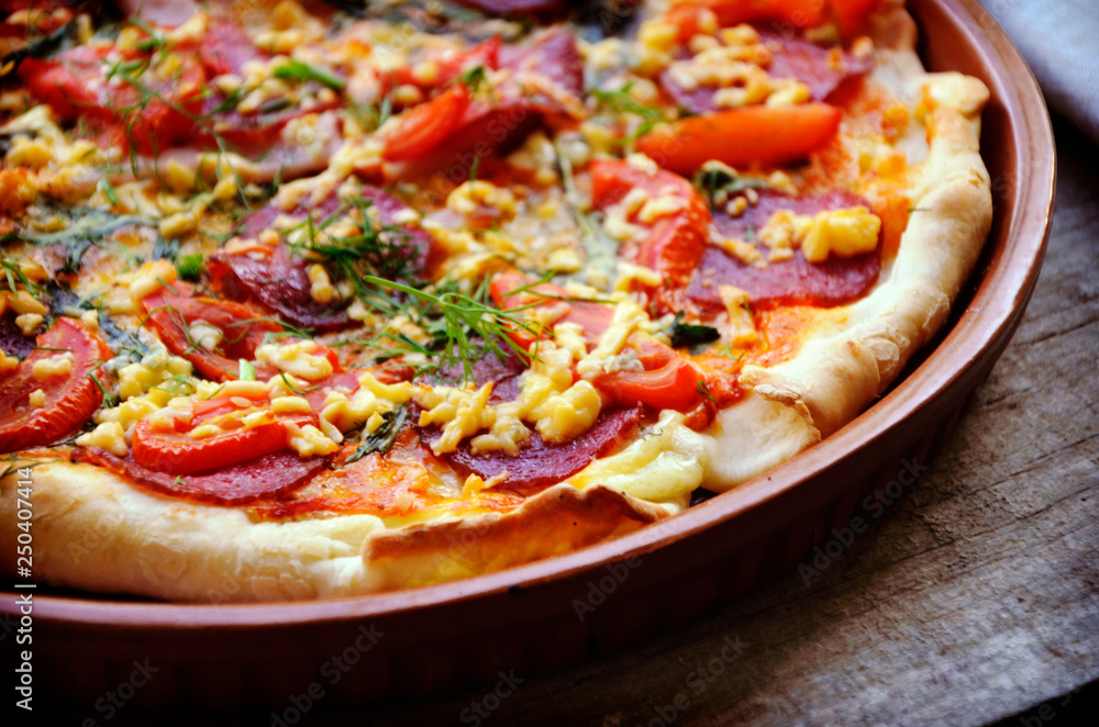 Delicious italian pizzas served on wooden table