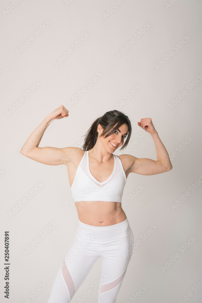 Girl with a sports outfit and white background