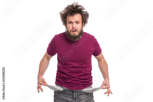 фотографія Crazy bearded Man with funny Haircut showing his empty pockets, turning his pockets inside out