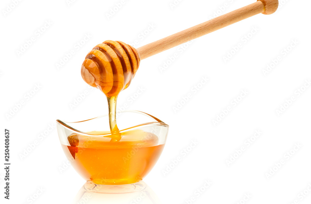 Honiglöffel mit rundem Glasschälchen als Freisteller Honiglöffel mit rundem Glasschälchen als Freisteller