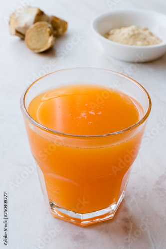 Jamu Healthy Asian Drink with Turmeric and Cinnamon Stick, Orange Juice