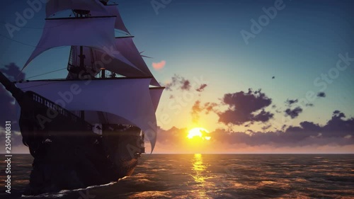 Large medieval ship on the sea on a sunset. The old medieval ship gracefully sails in the open sea.