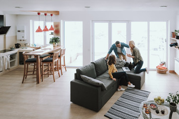 Happy family spending time together at home
