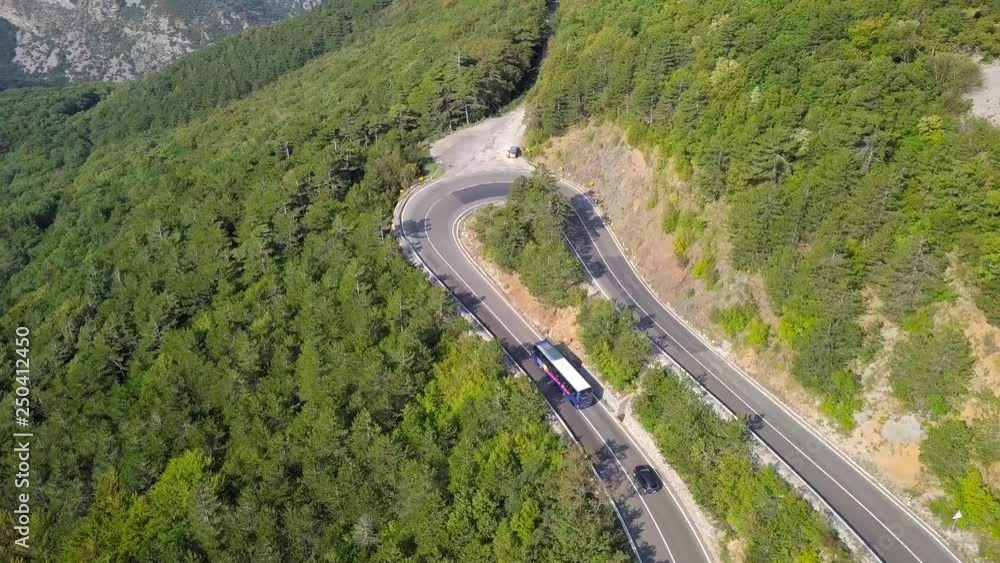 Aerial view of the serpentine road and a beautiful mountain landscape Aerial view of the serpentine road and a beautiful mountain landscape