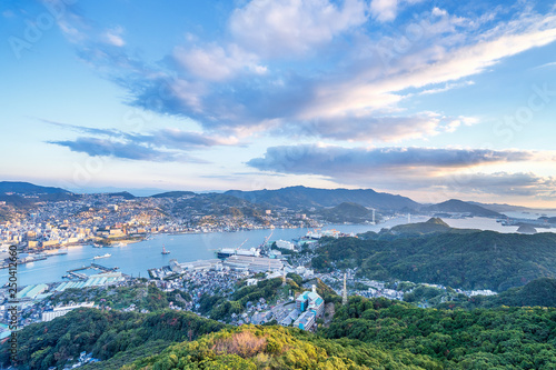 Fotografie Business concept, modern cityscape of nagasaki dusk from mount inasa, the new to