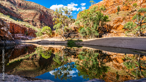 Scenic view of Ormiston gorge water hole in the West MacDonnell Ranges outback Australia photo