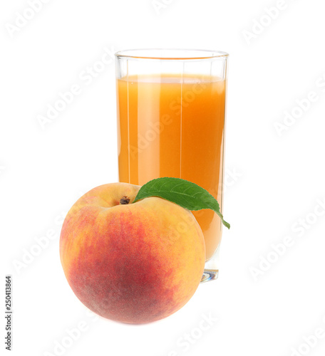 glass of peach juice with green leaf isolated on white background