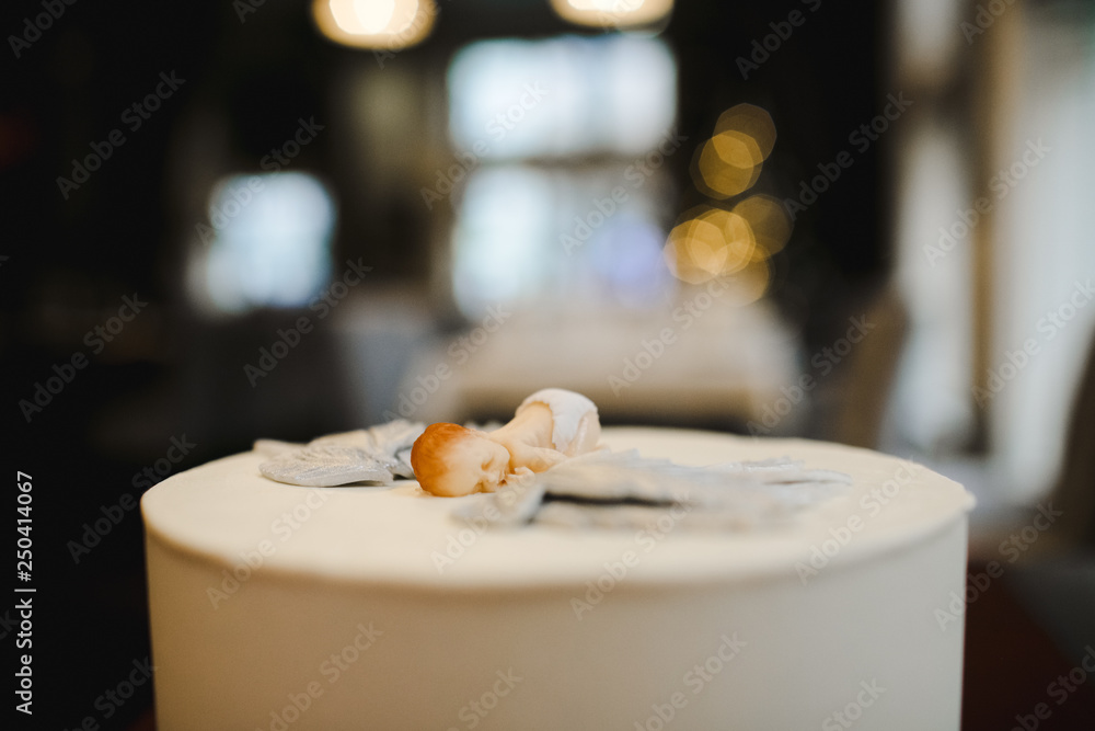 Figure of little baby with wings made on a white cake for baby's birthday Figure of little baby with wings made on a white cake for baby's birthday