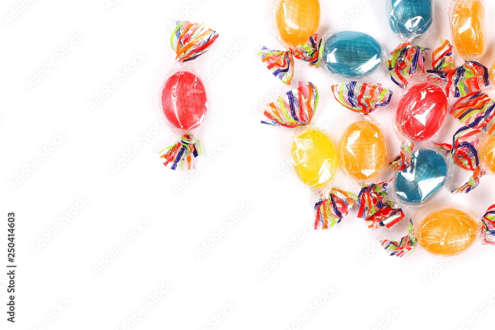 Colorful hard candies in transparent cellophane wrapping, isolated on