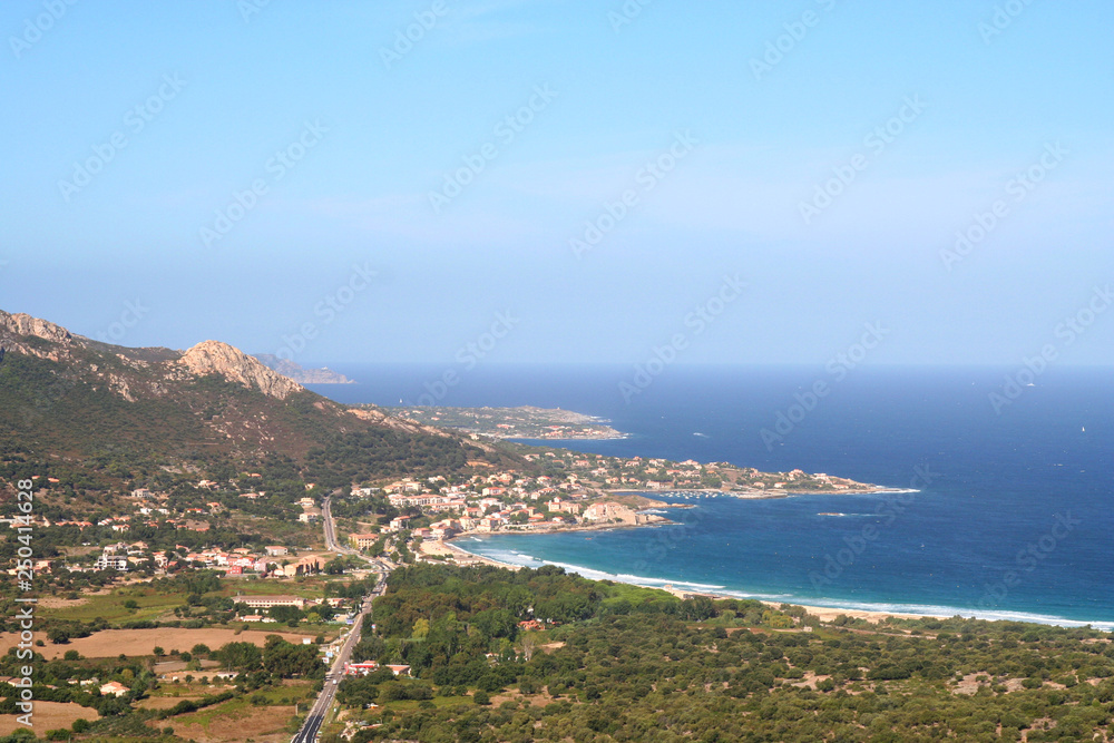 The northern coast of Corsica, France, around the village of Algajola.Beautiful view of the blue Mediterranean meeting the pristine shore.