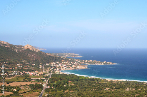 The northern coast of Corsica, France, around the village of Algajola.Beautiful view of the blue Mediterranean meeting the pristine shore. © George Green