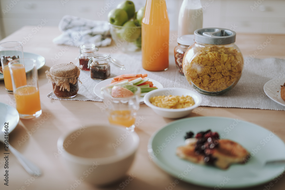 Healthy breakfast on the table with juice in bottle and glasses Healthy breakfast on the table with juice in bottle and glasses