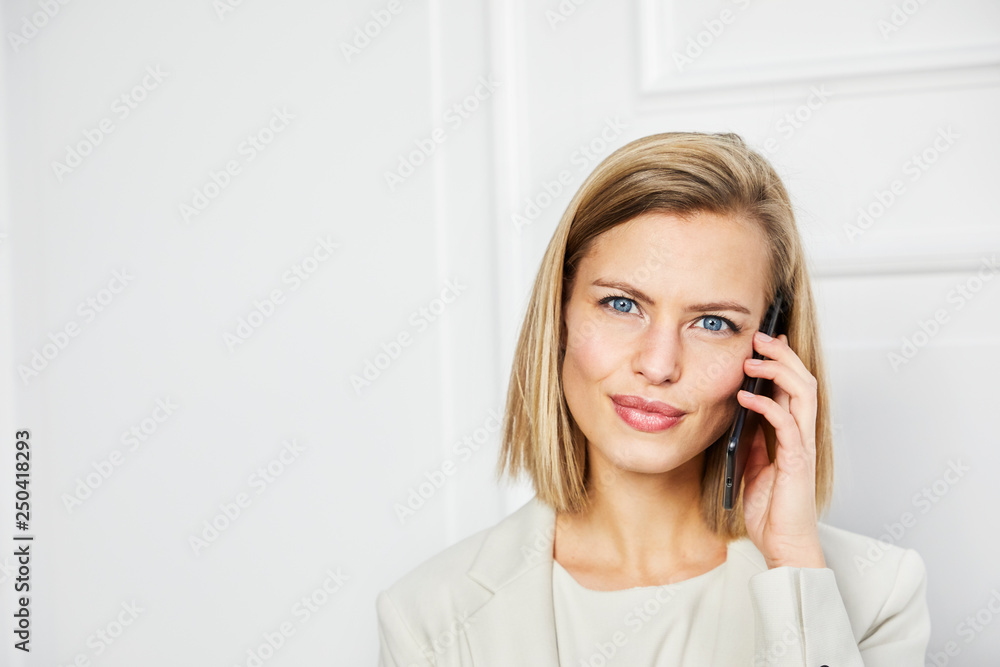Portrait of stunning woman on call, smiling Portrait of stunning woman on call, smiling