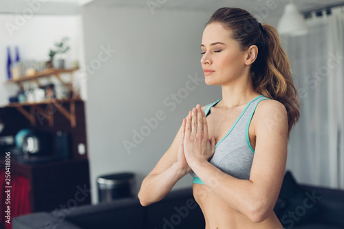 Free Download Young balanced lady holding hands in namaste - GFXLoad