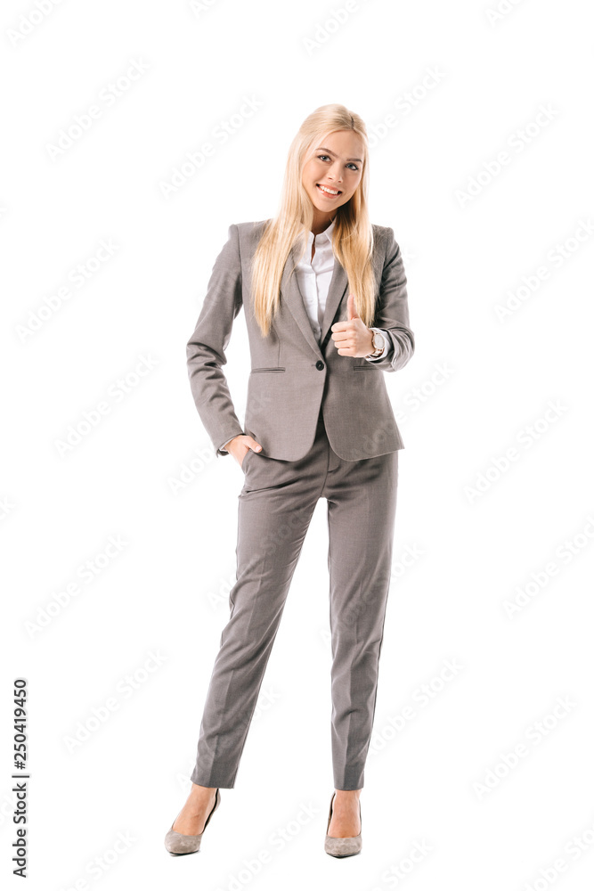 smiling businesswoman in grey suit showing thumb up isolated on white smiling businesswoman in grey suit showing thumb up isolated on white