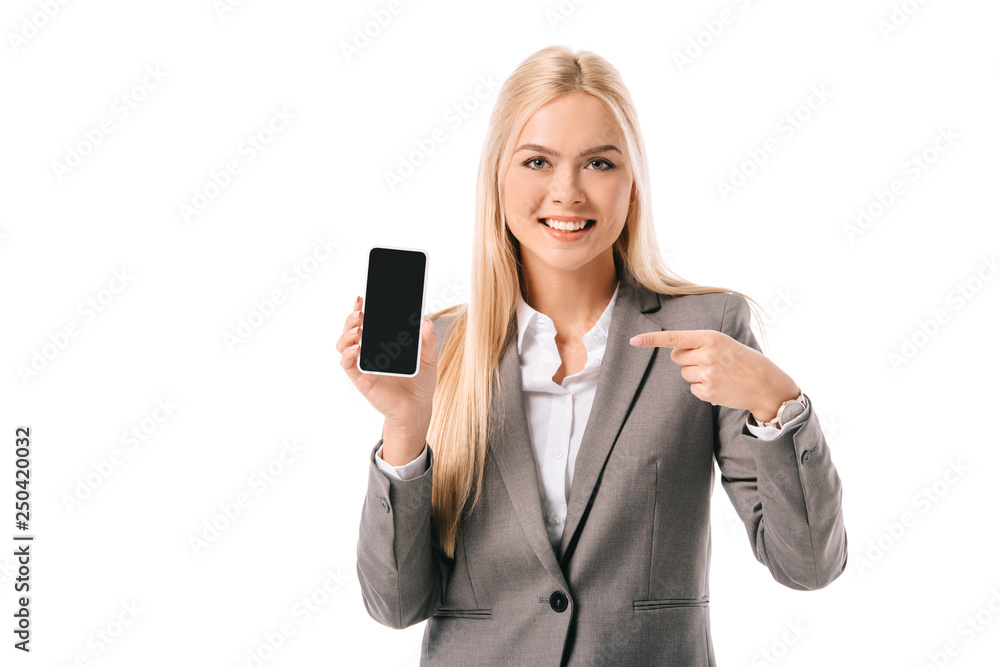 smiling businesswoman pointing at blank screen on smartphone, isolated on white smiling businesswoman pointing at blank screen on smartphone, isolated on white