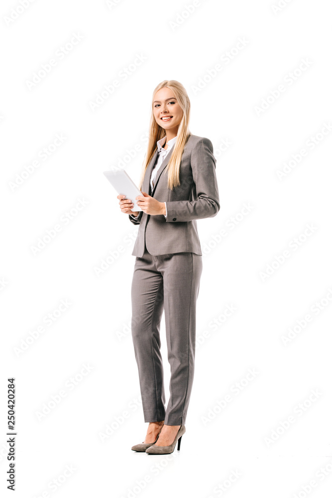 beautiful smiling businesswoman in suit using digital tablet isolated on white beautiful smiling businesswoman in suit using digital tablet isolated on white