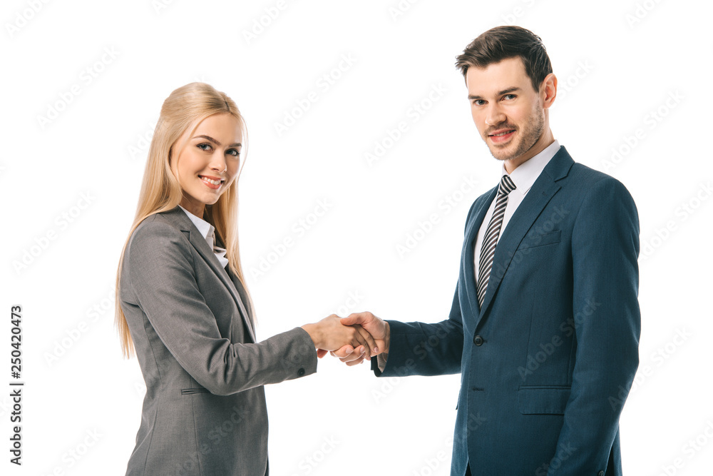 handsome businessman and beautiful businesswoman shaking hands and making deal isolated on white