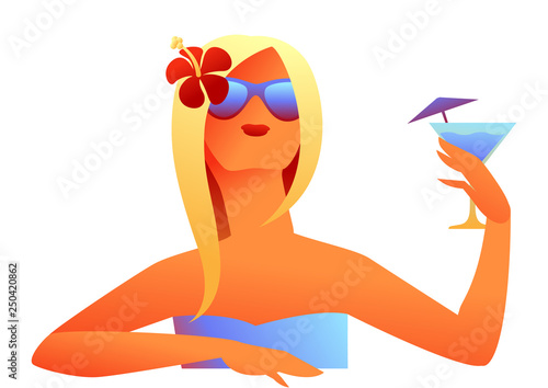 Girl sunbathes on beach with cocktail.