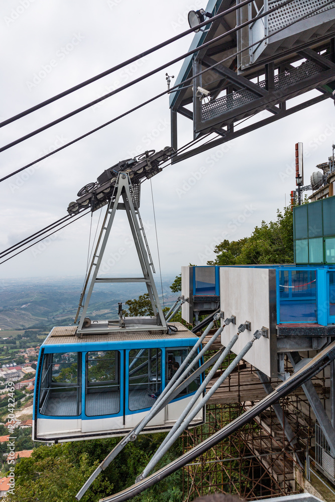 Fototapeta premium Cable car funicular raising tourists in San Marino