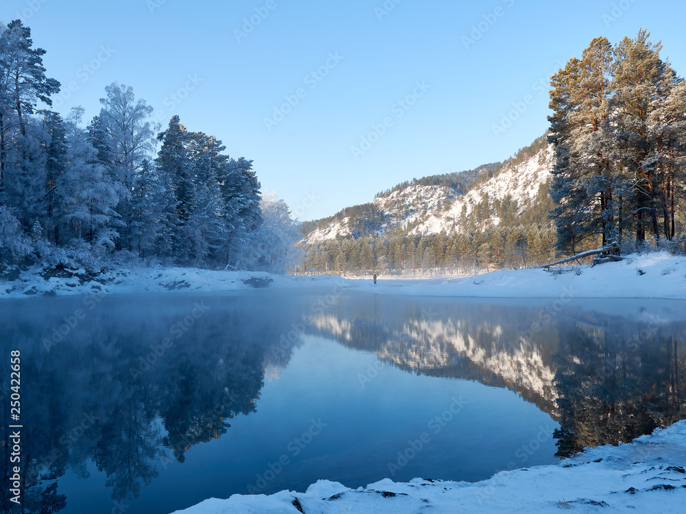 Blue Lake in the Mountain Valley of the Katun River, Chemale region. The Republic of the Mountain Altai. winter view of the lake in the mountains. fantastic nature. Winter landscape.