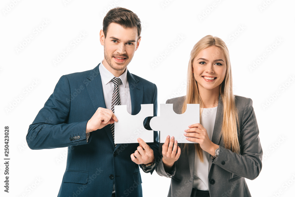 smiling businesspeople holding puzzle pieces isolated on white, business strategy concept smiling businesspeople holding puzzle pieces isolated on white, business strategy concept