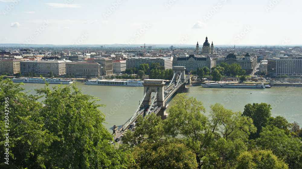 Top view of the Danube river, roofs and the Szechenyi Chain Bridge in Budapest, sunny day, Hungary