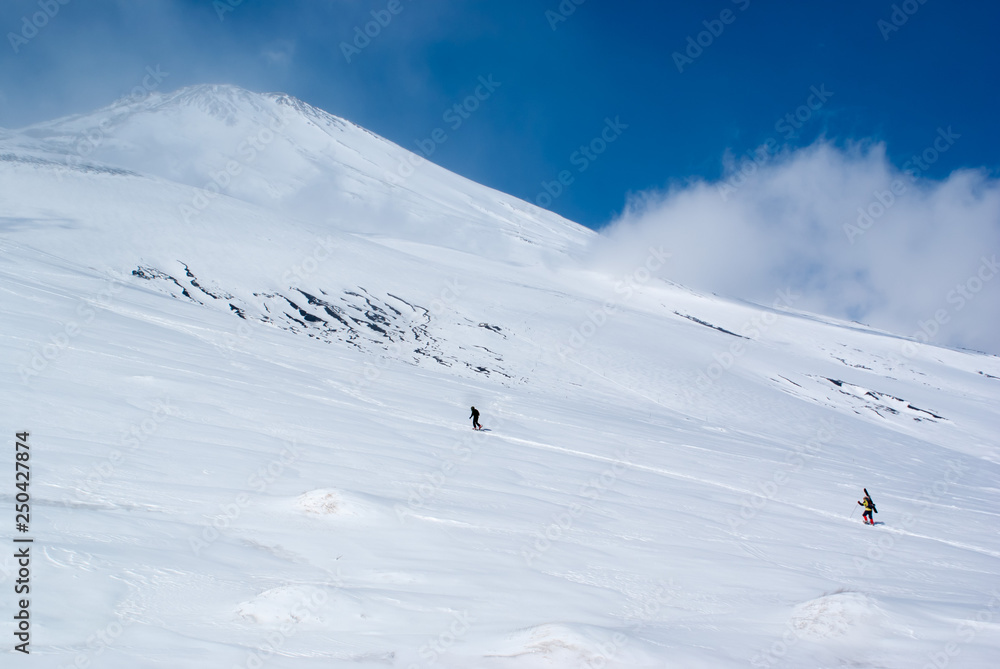 Mountain skiers climb Mt. Fuji in winter - 冬の富士山を登る山スキーヤーたち