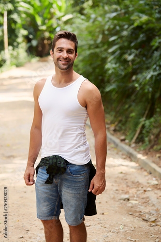 Smiling guy in vest and shorts, portrait