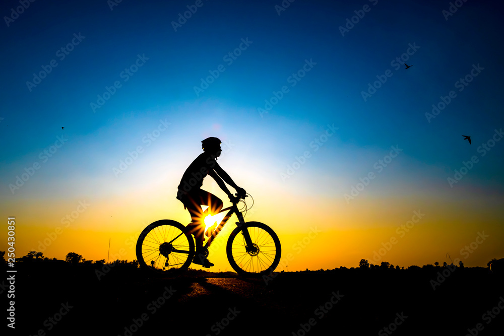Silhouette of cyclist in sunset background. Silhouette of cyclist in sunset background.