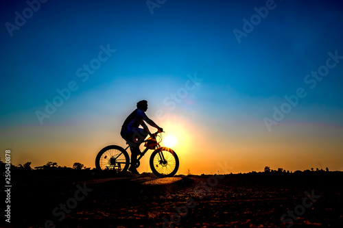 Wallpaper Mural Silhouette of cyclist in sunset background. Torontodigital.ca