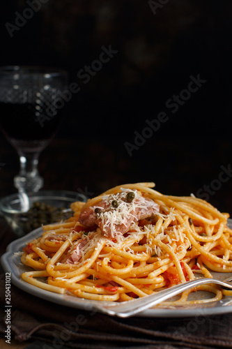 Pasta with chunks of fresh tuna, tomato and capers