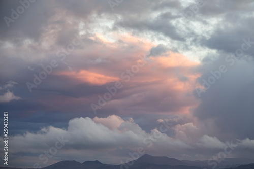 Colorful clouds over mounta...