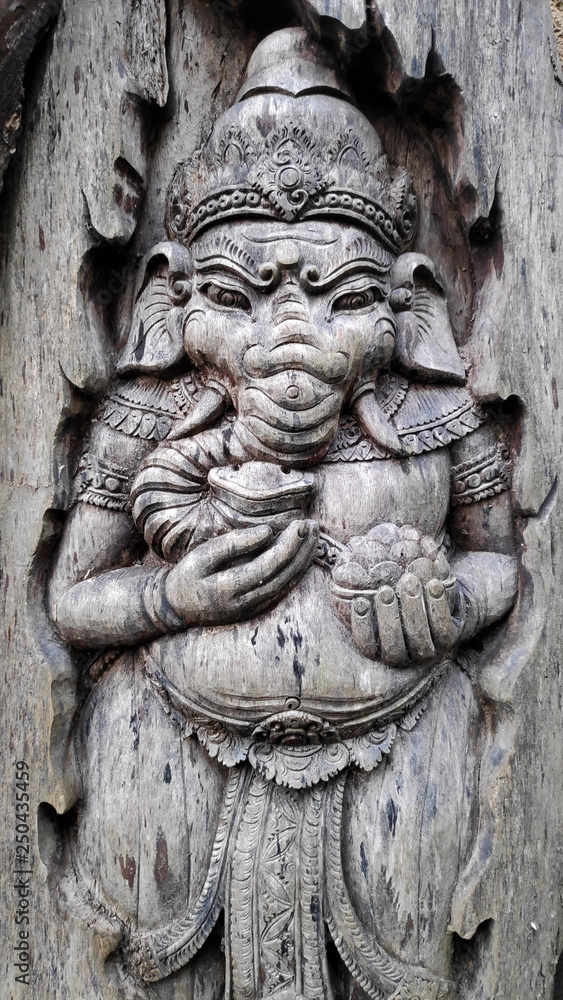 Old elephant shape wood sculpture in Bali