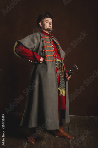 Obraz na płótnie Portrait of a man in a medieval costume on a dark background