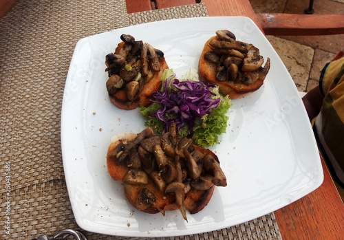 Mushroom appetizers  with green lettuce and red cabbage