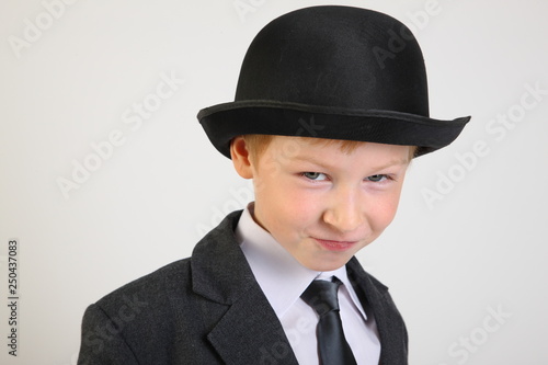 hat, boy, smile, school clothes, portrait, boy, child, schoolboy with a phone, artist, actor, boy actor, young model, portrait boy, school suit, school uniform, tie, conversation, blond, posing