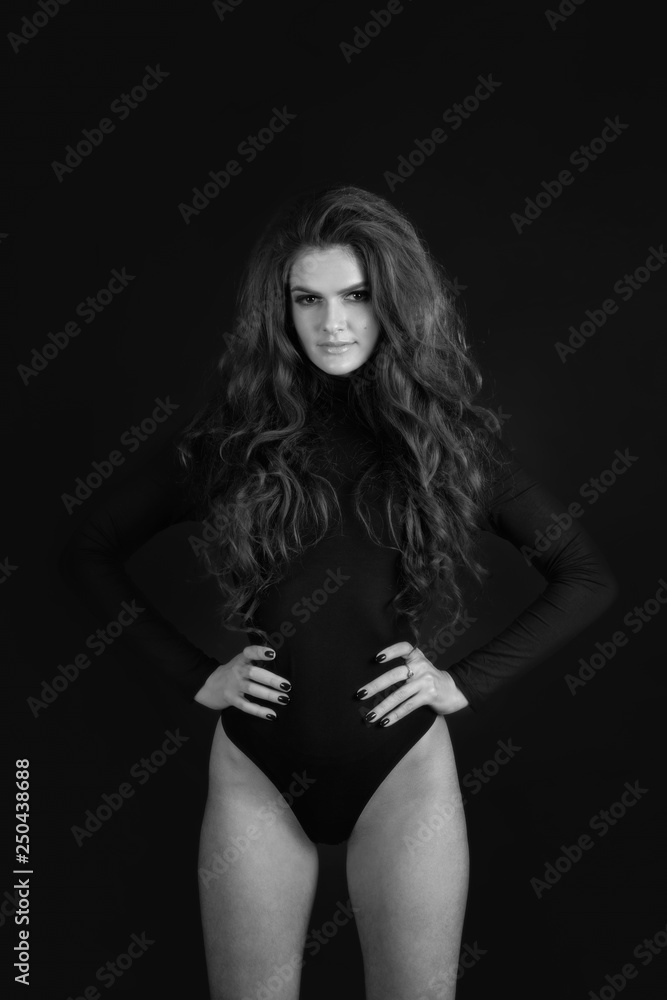 Portrait of a girl in a studio on a black background. Portrait of a girl in a studio on a black background.